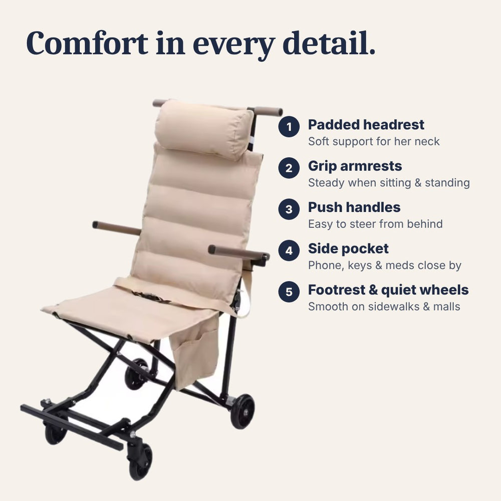 Chair features: padded headrest, armrests, push handles, side pocket, footrest