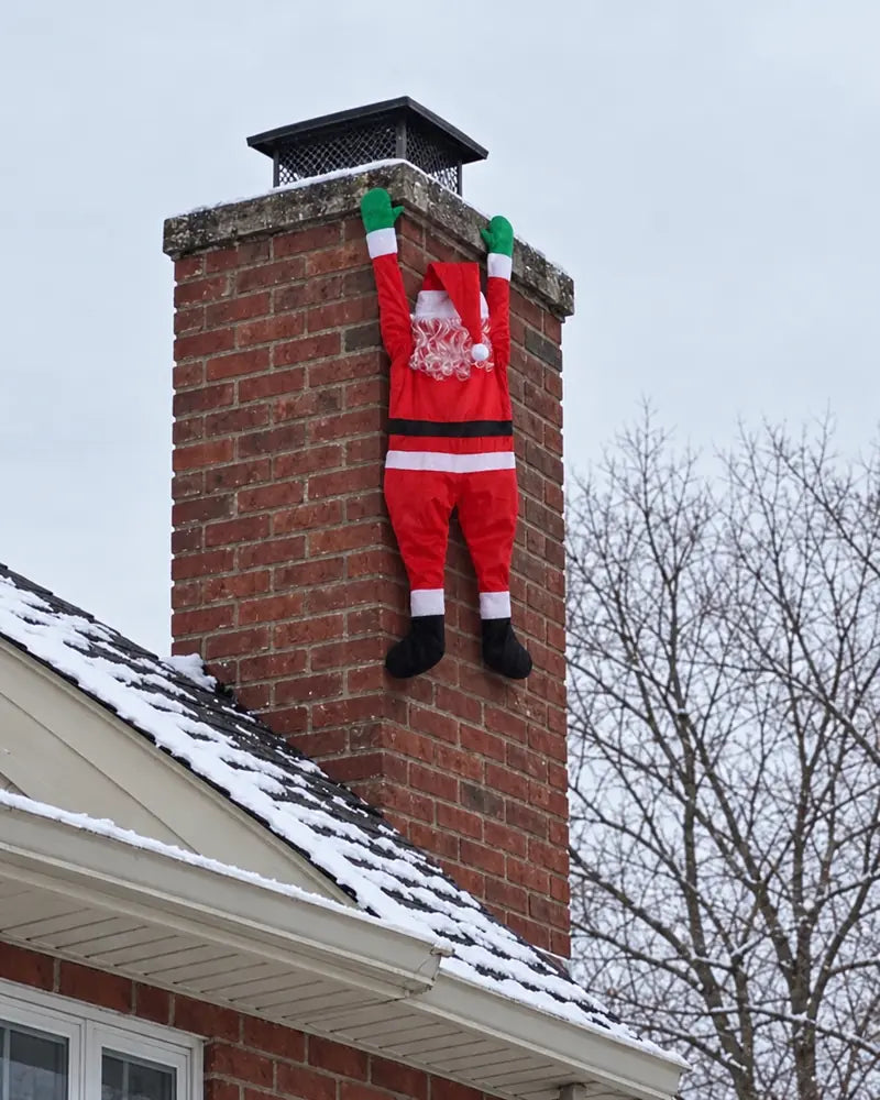 Climbing Santa on a brick chimney